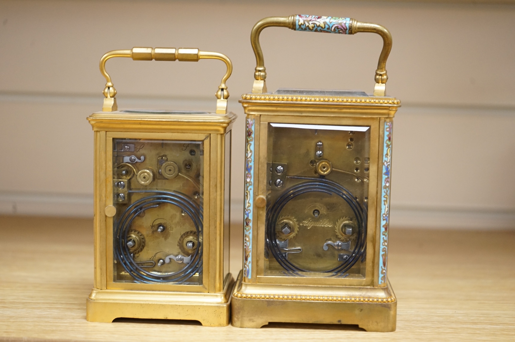 Two French carriage clocks, one champlevé enamelled, tallest 15cm